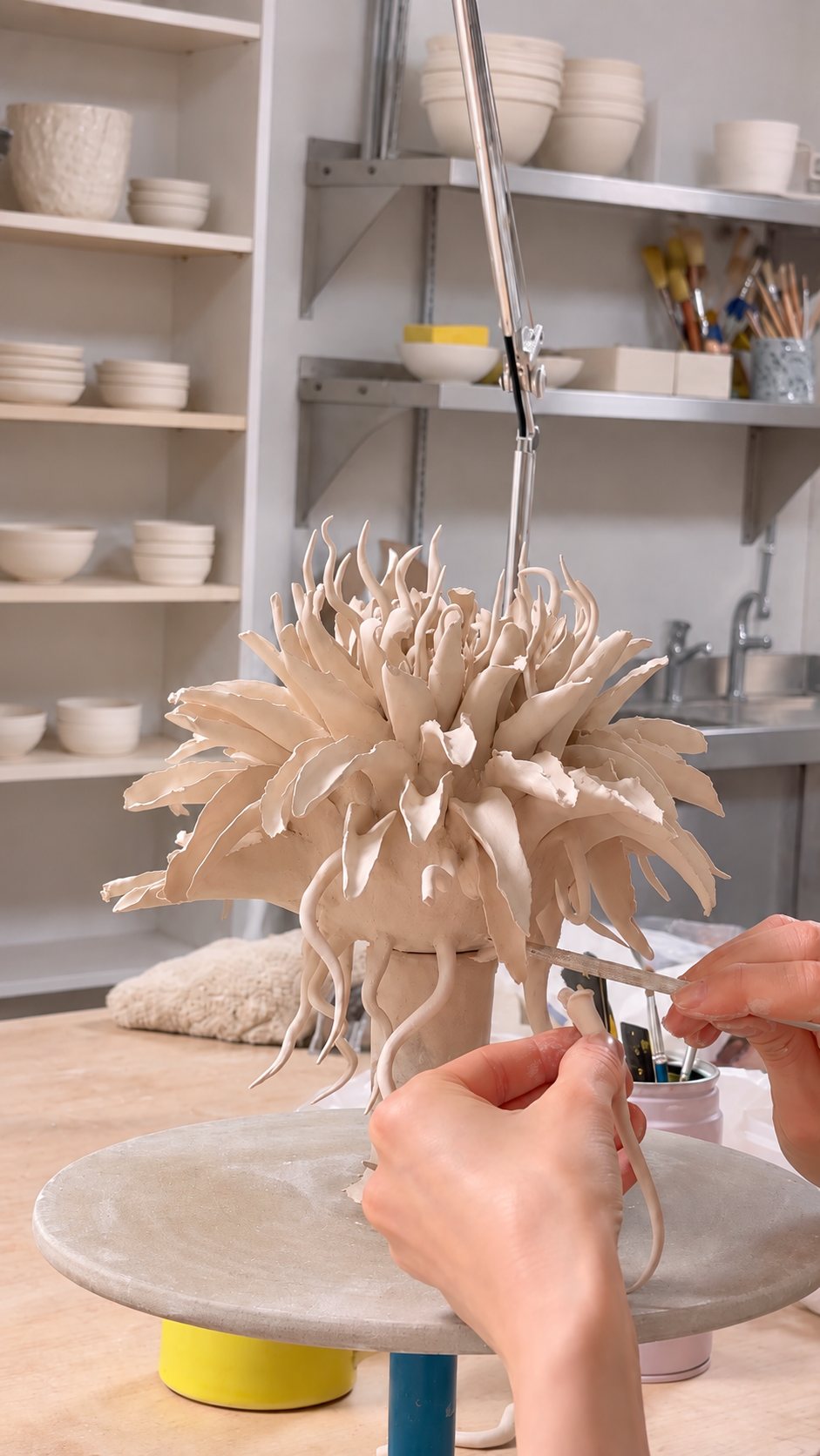 Assembling porcelain petals in the studio